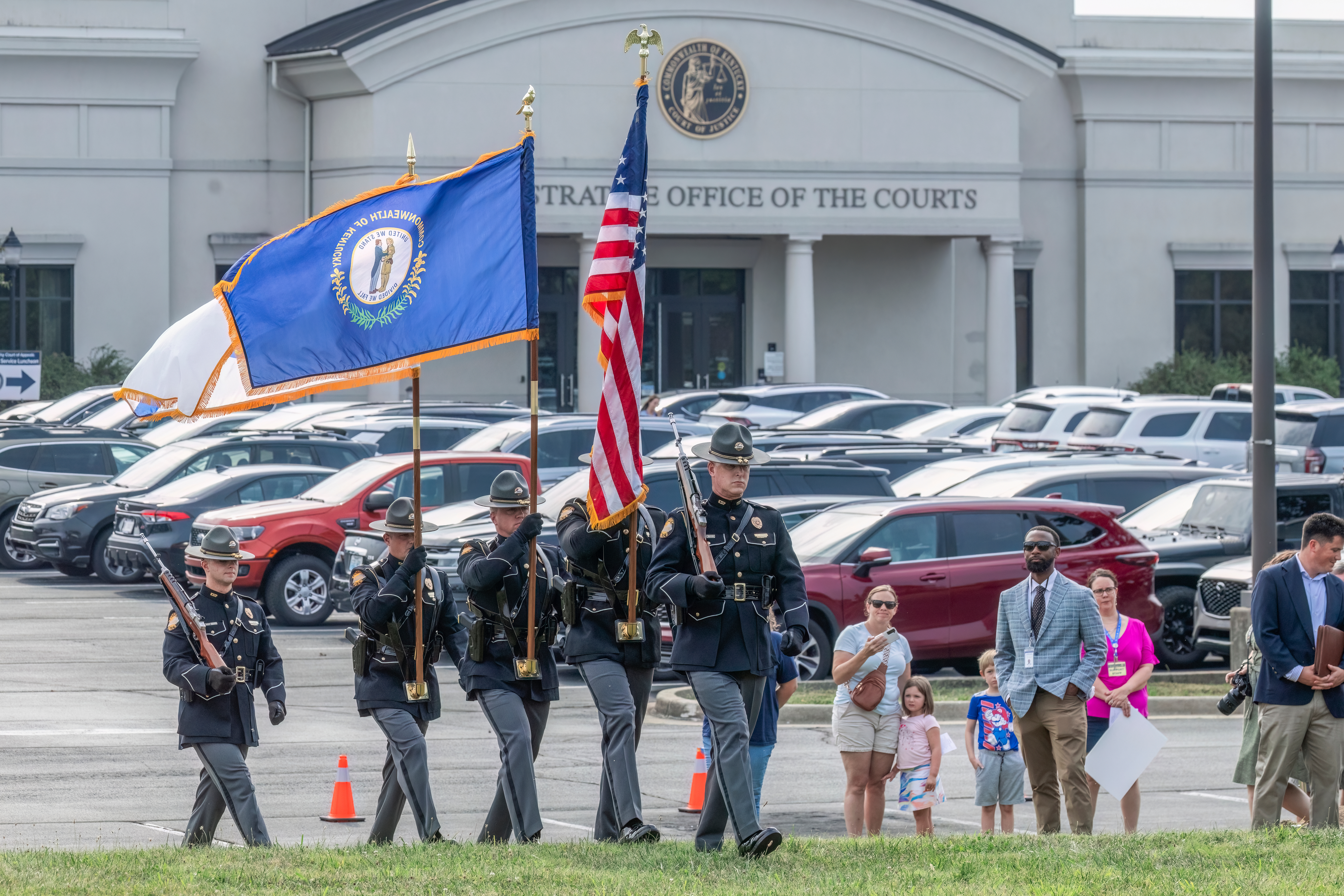 National Guard walking on the lawn to the ceremony.