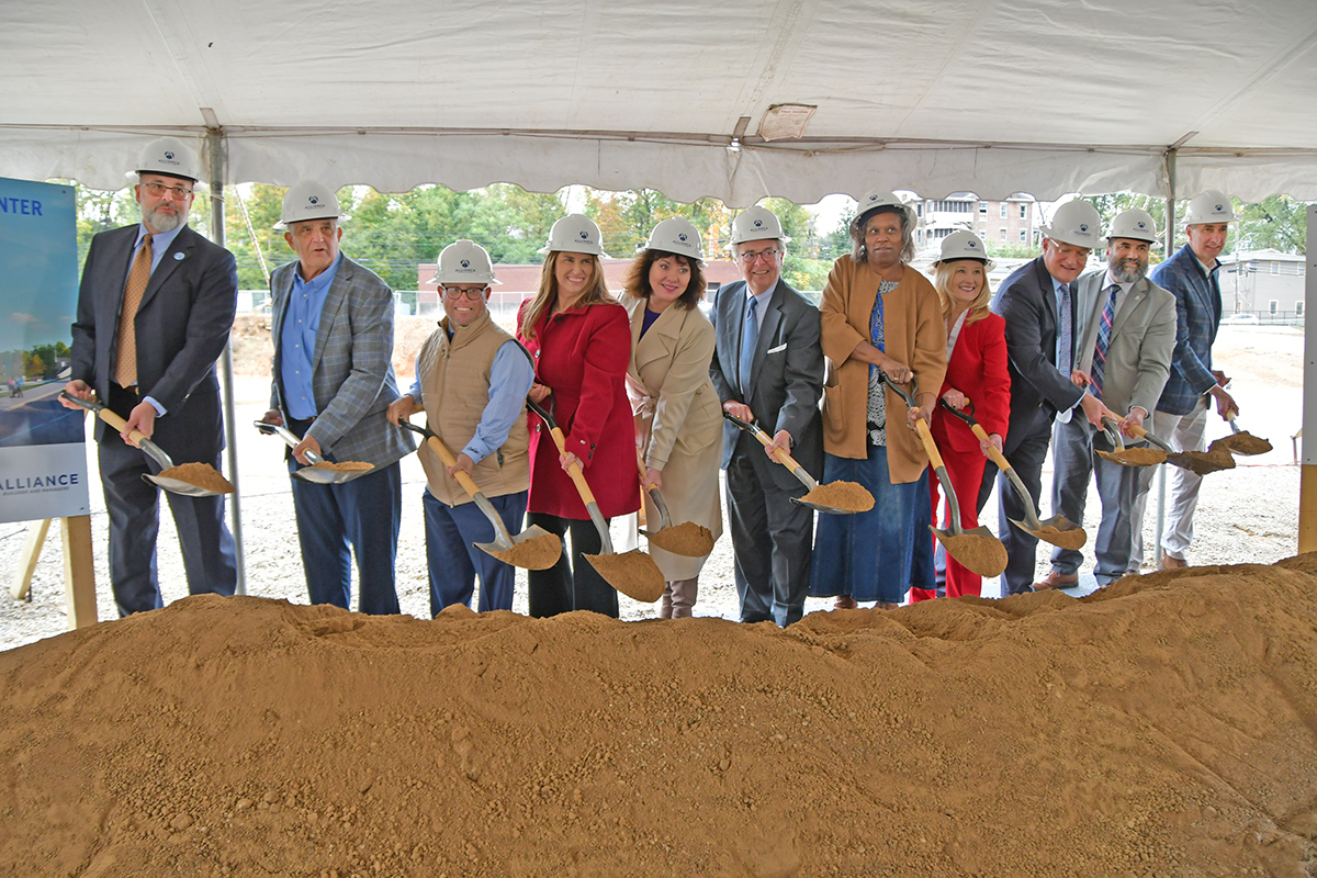 Chief Justice Lambert along aside others with shovels to symbolize groundbreaking.