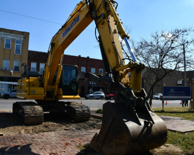 A large yellow Excavator used for construction. 