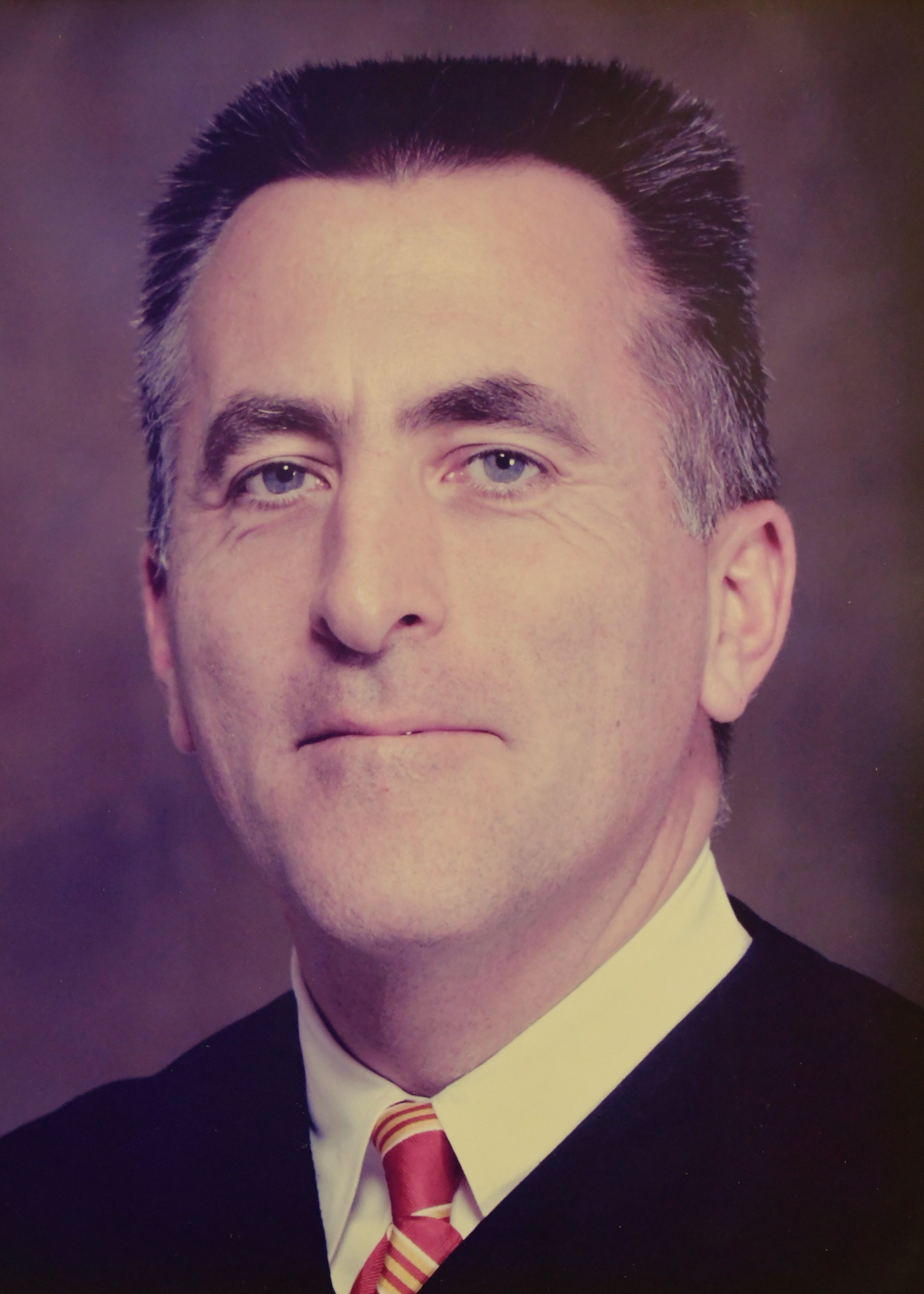 Official portrait of Judge Matthew J. Baker. 