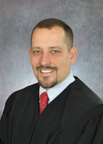 Official portrait of Jugde Nick Whitaker.